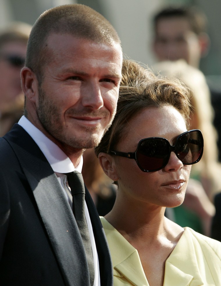 Image: Soccer player David Beckham and his wife Victoria arrive at the 2008 ESPY Awards in Los Angeles